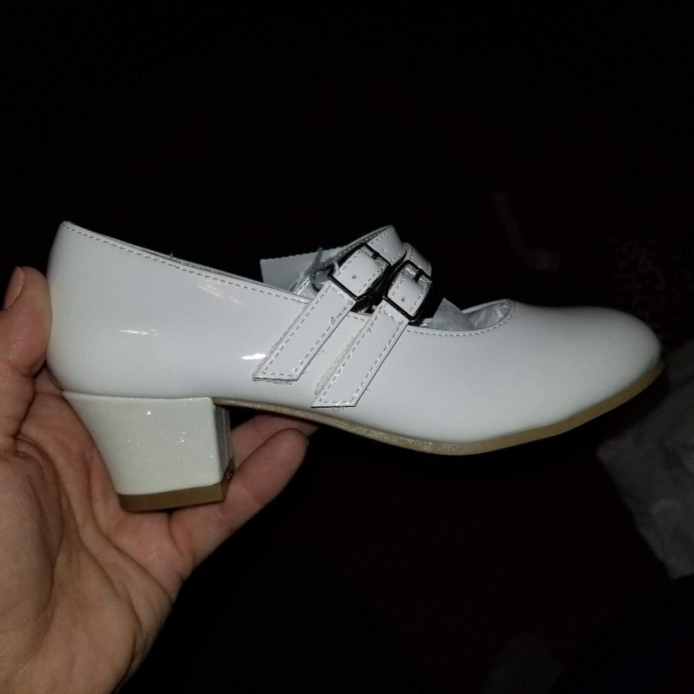 White patent leather pageant shoes.